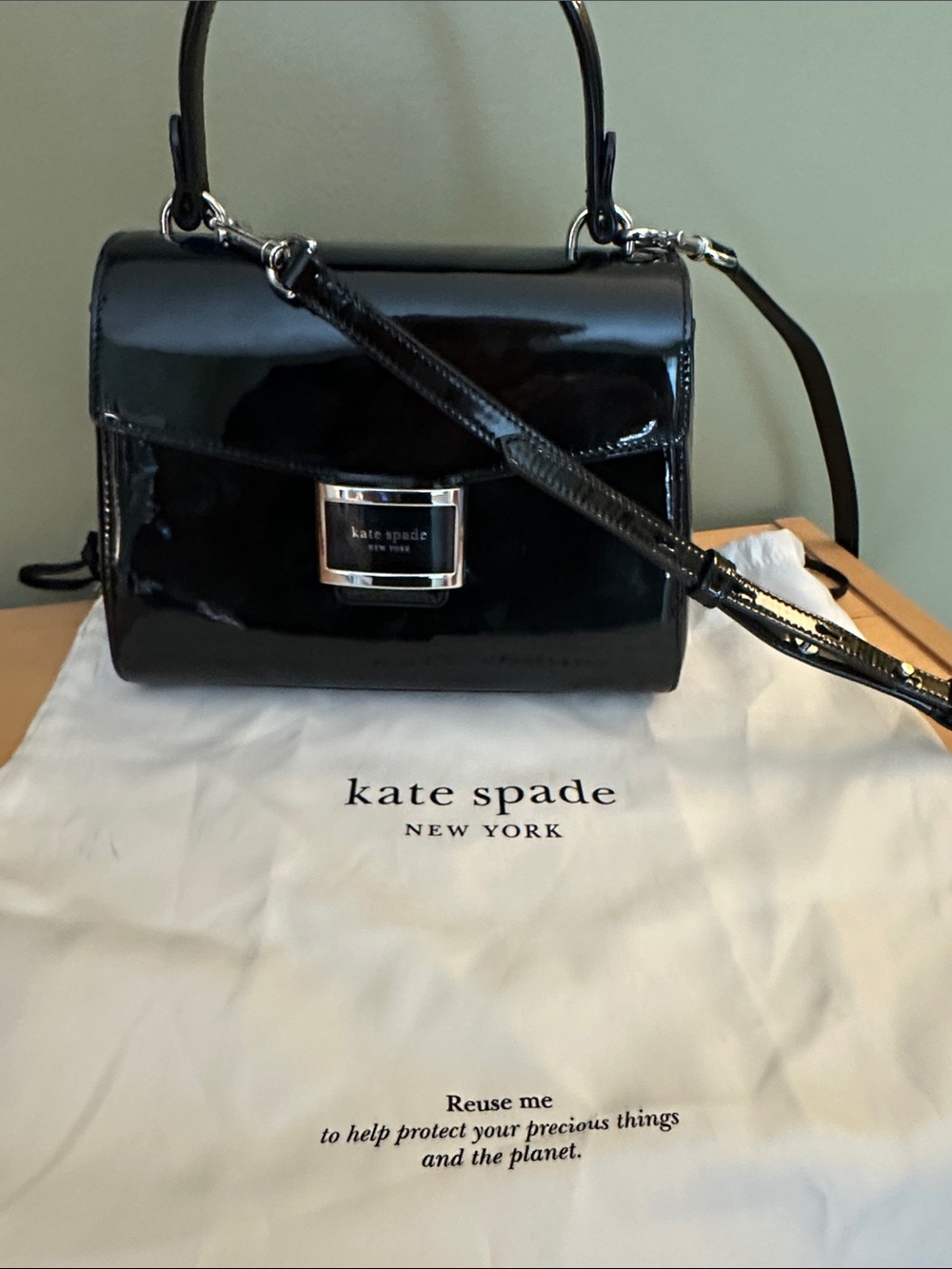 Kate Spade black, patent leather satchel with Top Handle